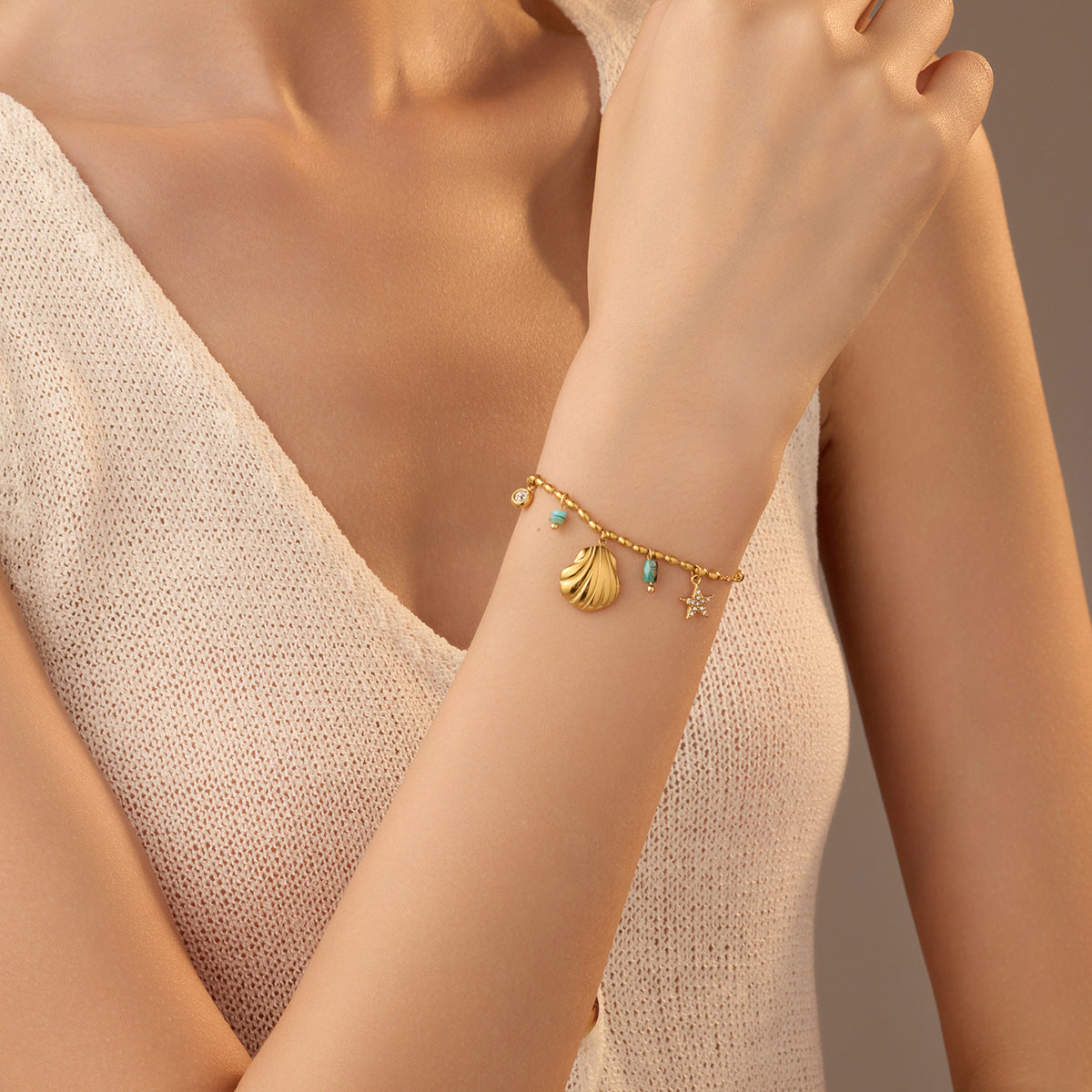 Fashionable Ocean-Inspired Shell and Star-Shaped Titanium Steel Bracelet with Zircon Inlay and 18K Gold Plating for Women