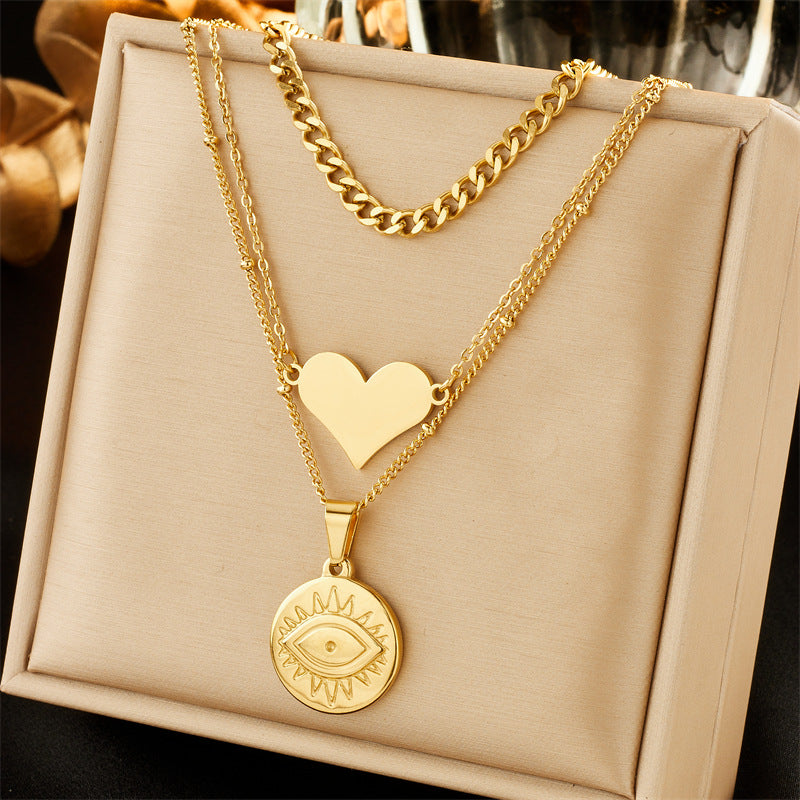 Collar con colgante minimalista de acero inoxidable con forma de corazón, incrustaciones de pedrería y cadena de cuentas de colores