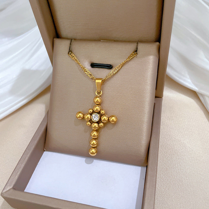 Collana Pendente a Croce con Catena a Sfera Minimalista in Acciaio al Titanio con Dettaglio Floreale Placcato Oro