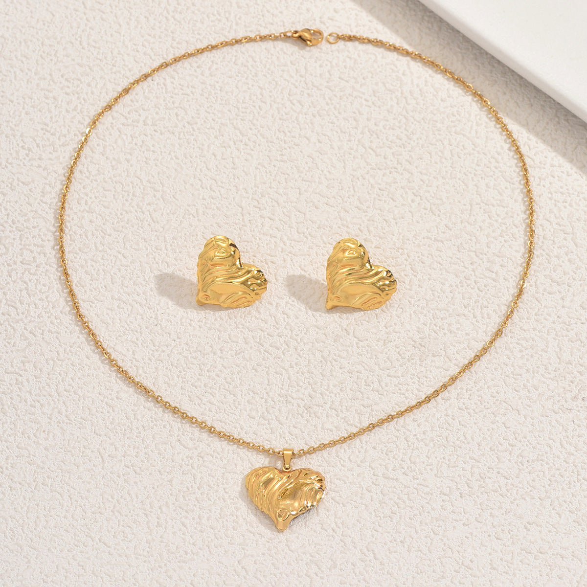 Set di collana e orecchini a pendente a cuore geometrico in lega con finitura placcata per donna
