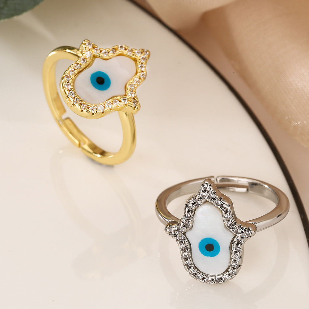 Anello da donna minimalista geometrico in rame placcato oro con micro-pavé di zirconi a forma di occhio turco