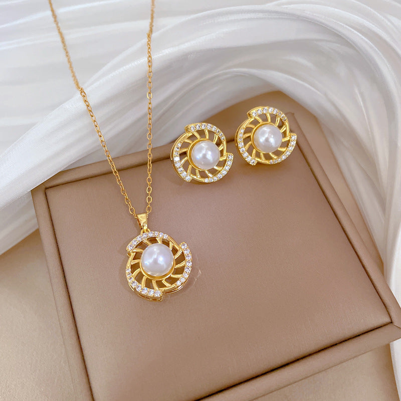 Conjunto de collar y pendientes de perlas giratorias de acero de titanio de lujo con incrustaciones completas de diamantes de imitación para mujer, diseño geométrico, joyería elegante para fiesta