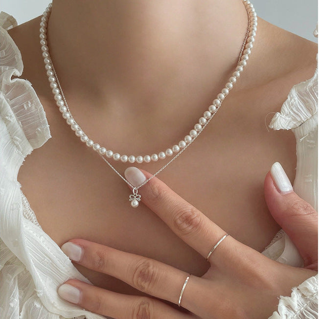 Minimalist Bow Knot Pendant Necklace in 925 Sterling Silver with Pearl Accents on Snake Chain
