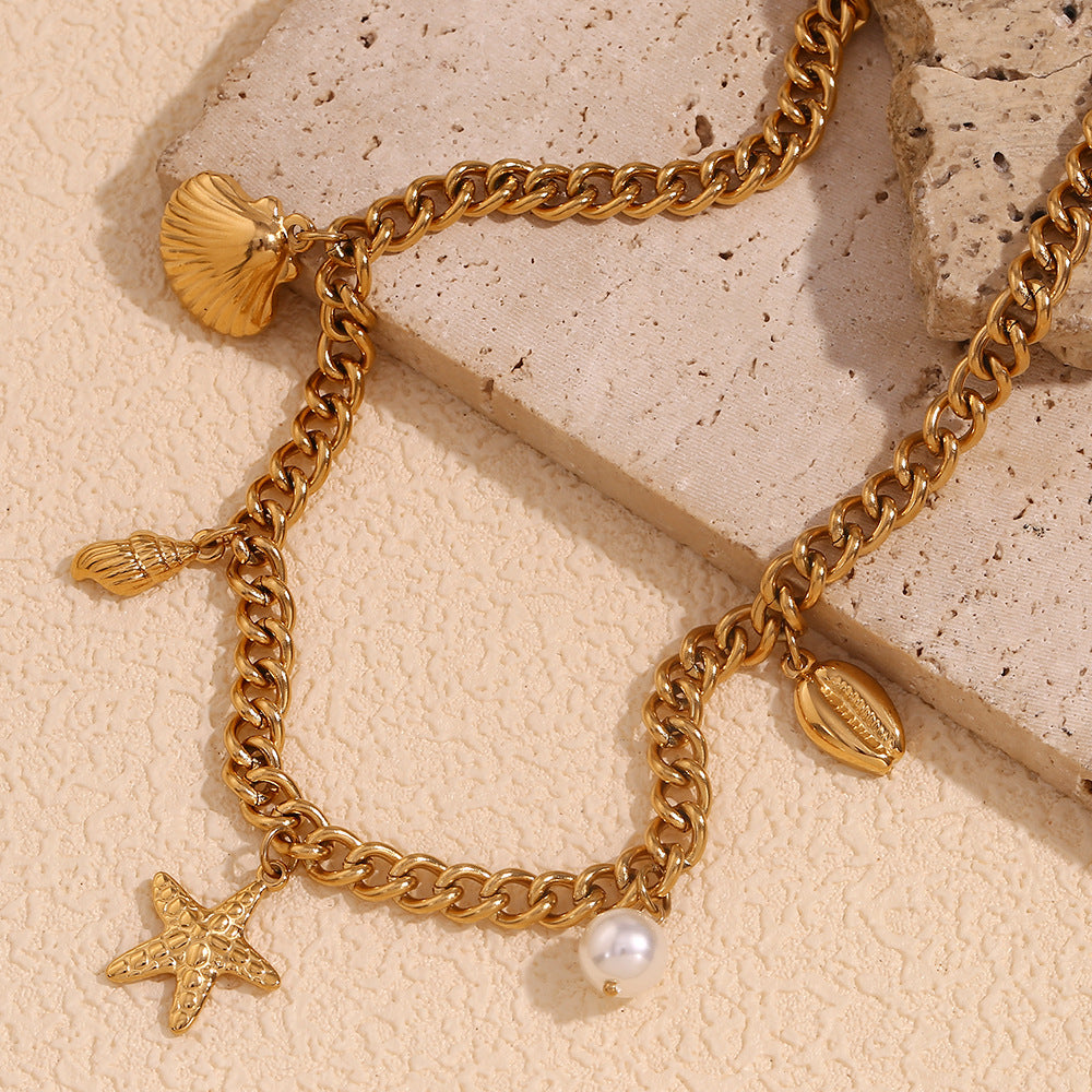 Collana con ciondolo a tema marino vintage per donna con catena in acciaio inossidabile e ciondolo in acciaio al titanio placcato oro 18 carati con motivi di conchiglie e stelle marine