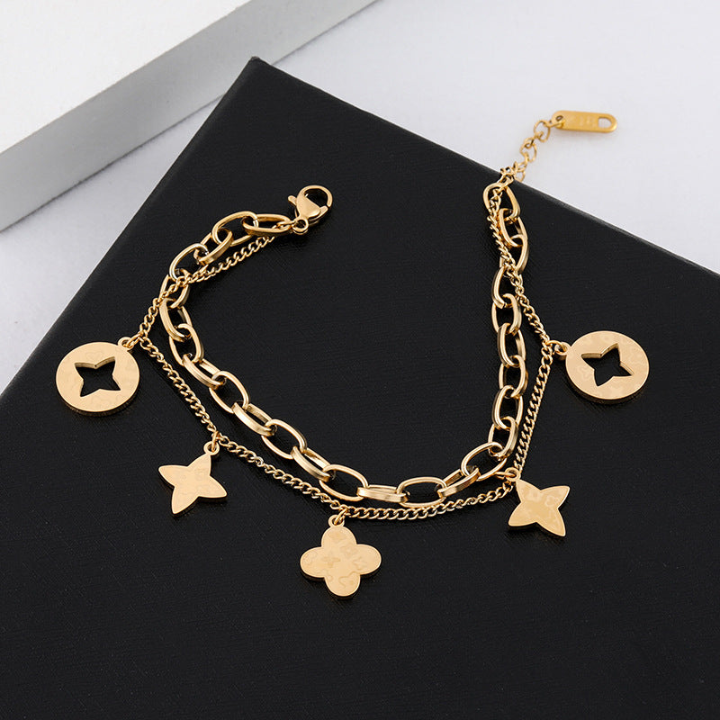 Elegante Pulsera Minimalista de Acero de Titanio con Colgante Redondo Bañado en Oro de 18K y Dije de Hoja para Mujer