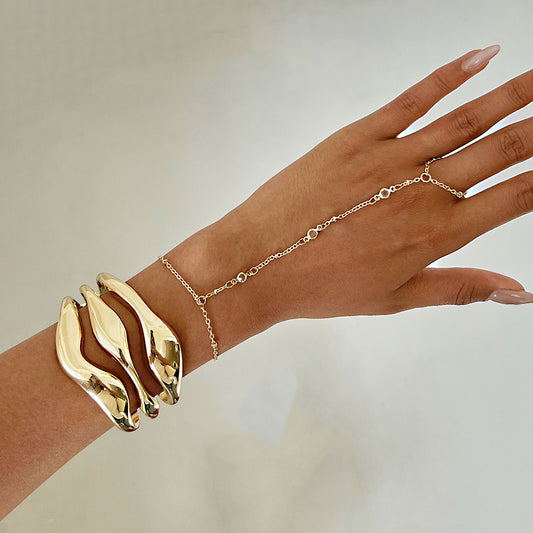 Bracciale rigido aperto da donna in lega lucida con design geometrico irregolare, alla moda e minimalista