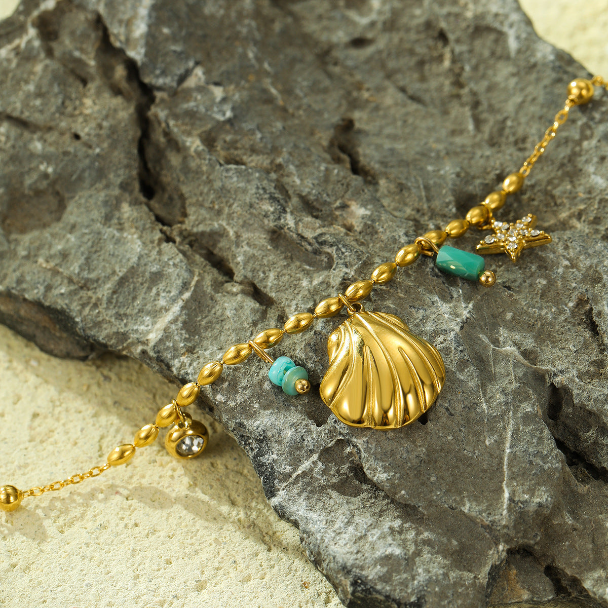 Fashionable Ocean-Inspired Shell and Star-Shaped Titanium Steel Bracelet with Zircon Inlay and 18K Gold Plating for Women