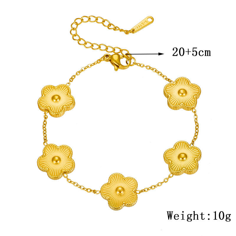 Bracciale da donna in acciaio al titanio placcato oro con motivo floreale alla moda