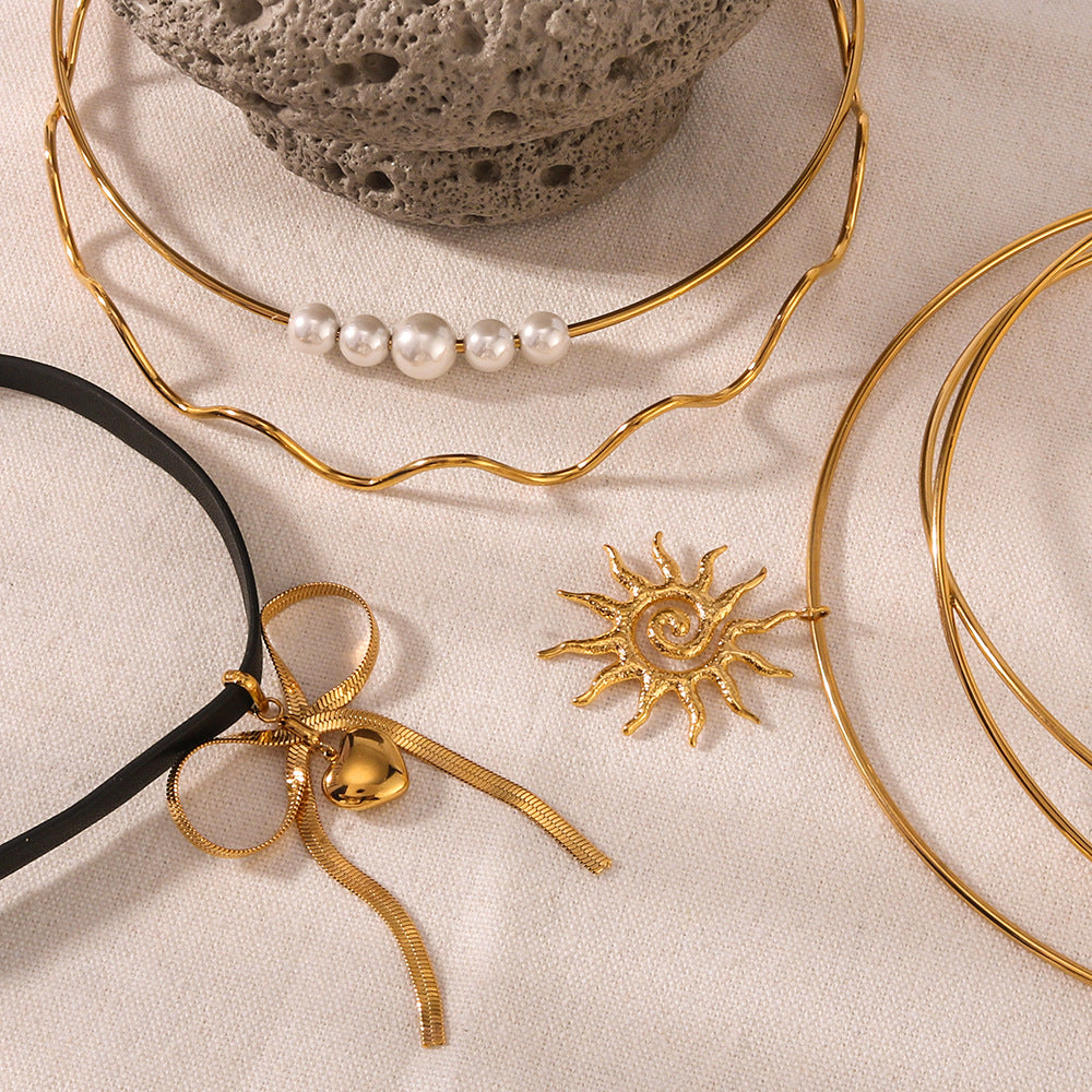 Minimalist Wave-Shaped Sunflower Bowknot Pearl Pendant Necklace in Stainless Steel with 18K Gold Plating for Women