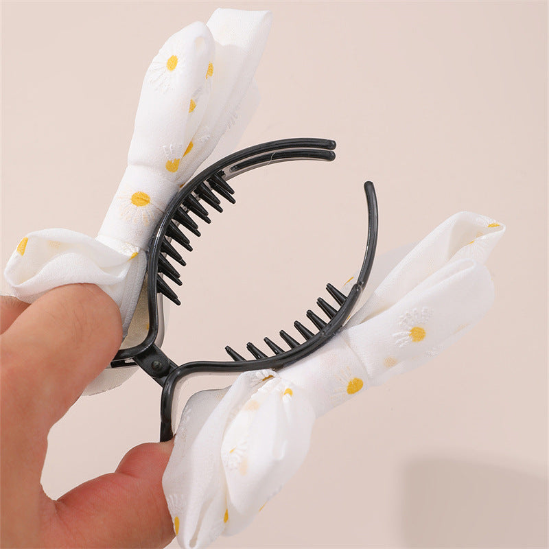 Dulce pasador de tela minimalista con lazo grande y diseño de margarita para niñas