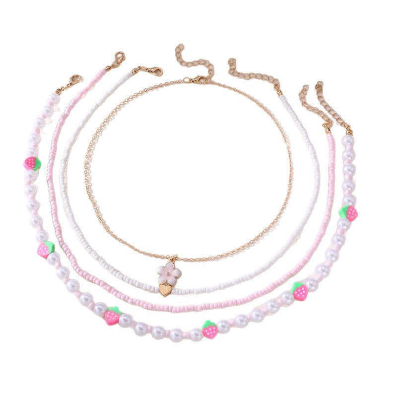 Collar con colgante de lazo y mariposa minimalista para niños, fabricado en resina con acabado esmaltado en tono rosa