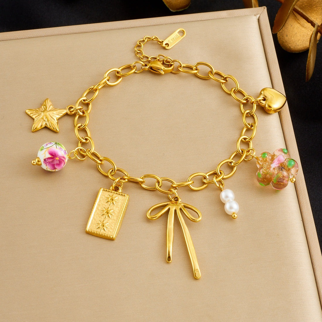 Sweet Gold Plated Stainless Steel Bracelet with Bow and Star Ceramic Charms