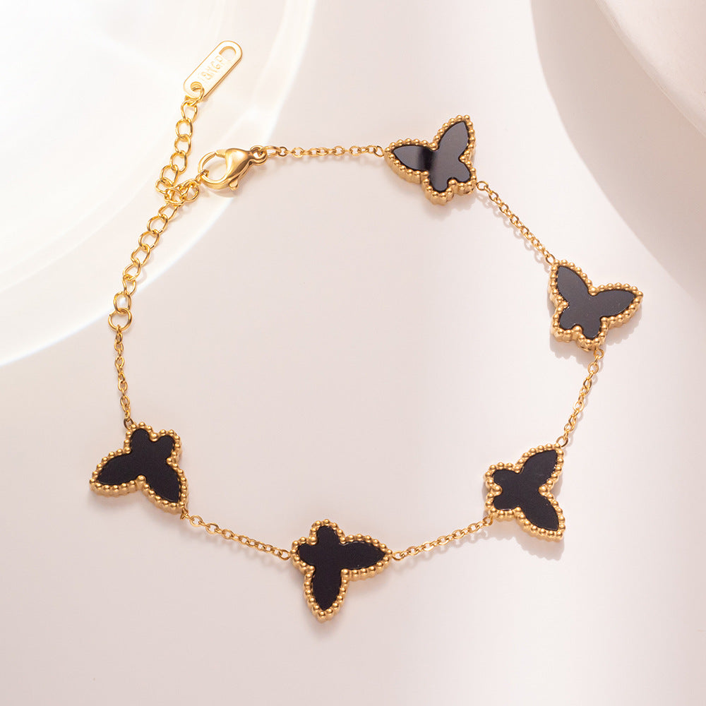 Set di collana, orecchini e bracciale minimalista con farfalla in acciaio al titanio con finitura placcata