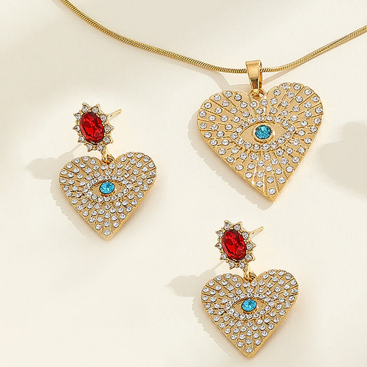 Conjunto de collar, pendientes y pulsera de aleación con colgante en forma de corazón de lujo engastado con diamantes de imitación para mujer