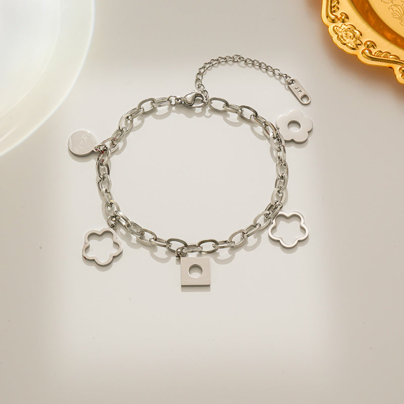 Bracciale da donna alla moda in acciaio al titanio a forma di rombo con ciondolo a fiore