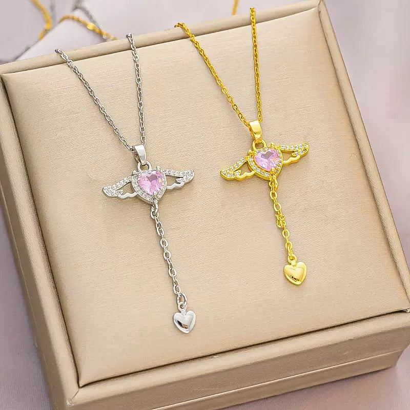 Collana Unisex con Pendente a Cuore Alato Movibile Minimalista di Lusso Leggero in Rame Geometrico con Zirconi e Catena a Croce in Acciaio al Titanio