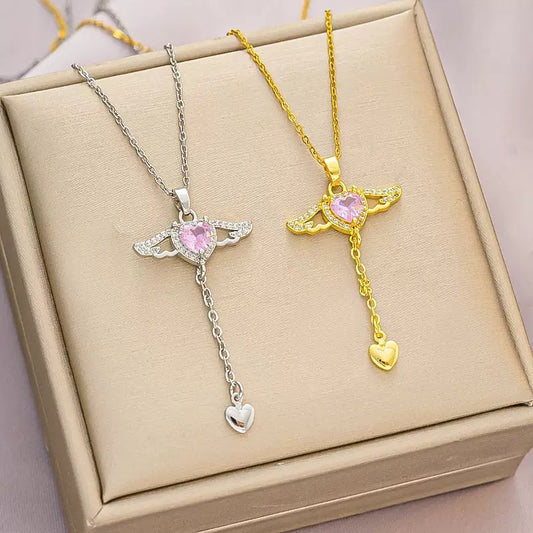 Collar con colgante de circonita de cobre con forma de corazón alado, geométrico, minimalista, de lujo ligero, con cadena cruzada de acero titanio, para unisex