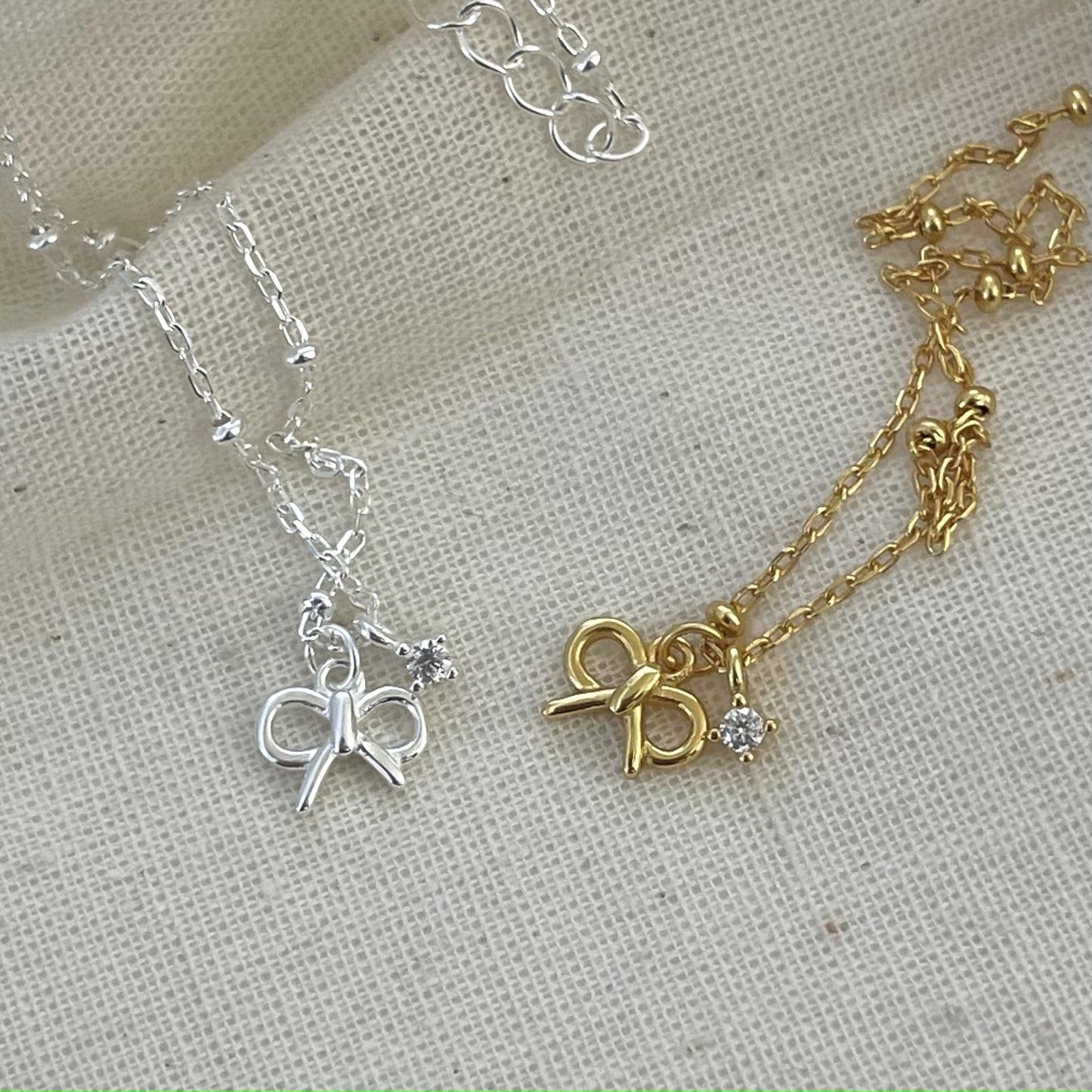 Minimalist Bowknot Pendant Necklace in 925 Sterling Silver with Cubic Zirconia Accents on Beaded Chain