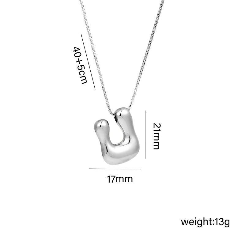Collar con colgante de acero titanio con forma de letra minimalista y chapado en oro para mujer