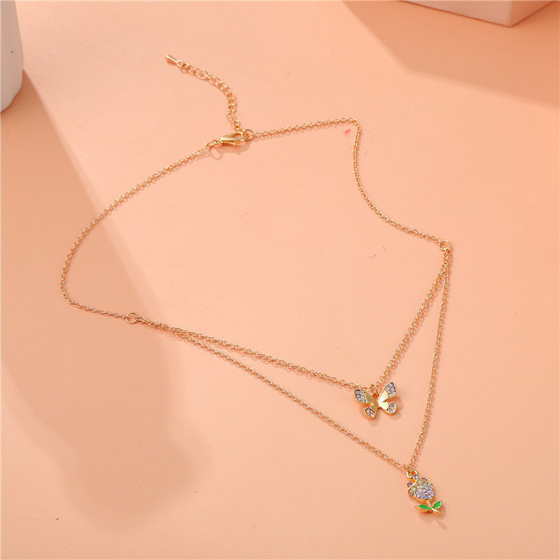 Elegante Collana con Ciondolo a Farfalla e Rosa Floreale per Bambini, Collana Multistrato in Lega con Intarsio di Strass e Catena a Croce