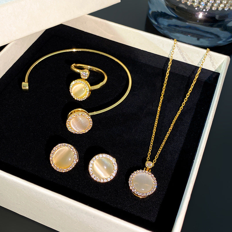 Minimalist Luxury Round Micro-Paved Cubic Zirconia Rotating Cat's Eye Moonstone Titanium Steel Necklace for Women