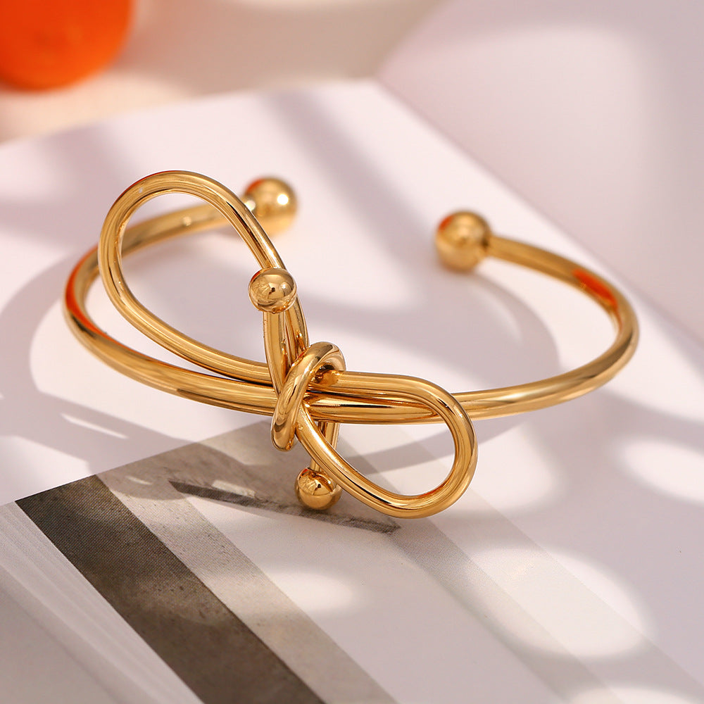 Bracciale da donna in acciaio inossidabile placcato oro 18K con fiocco, stile minimalista e alla moda