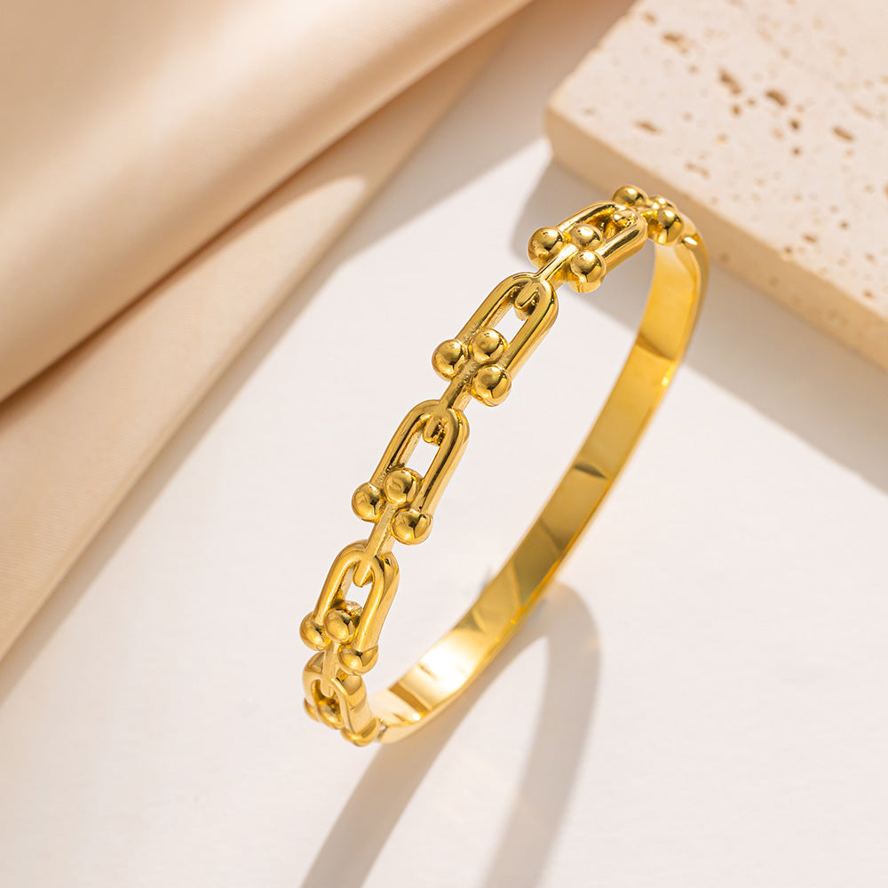 Bracciale minimalista a ferro di cavallo a U in acciaio al titanio con finitura liscia elettrolitica sottovuoto