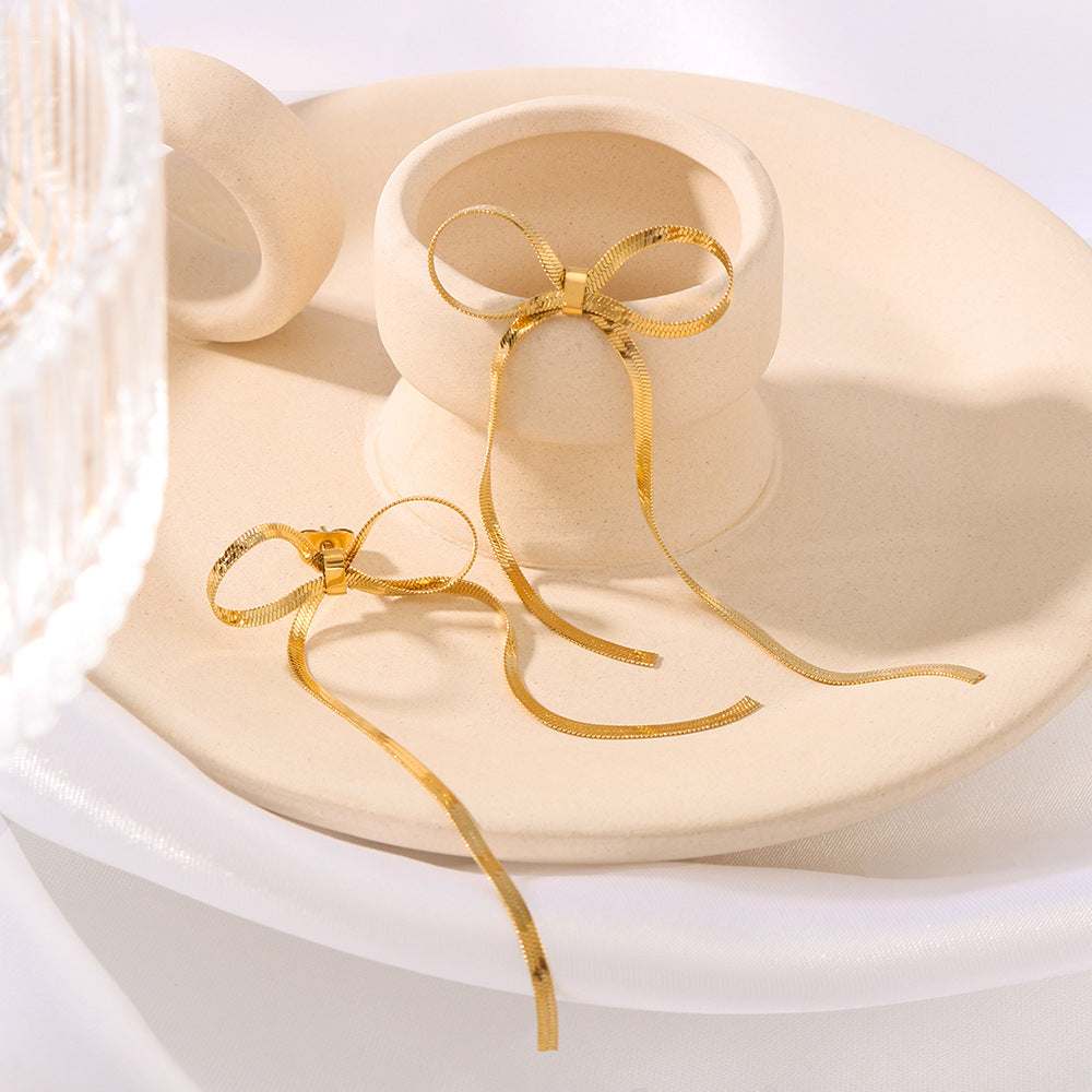 Fashion Bow-Shaped Tassel Long Earrings in Stainless Steel with 18K Gold Plated Snake Chain for Women