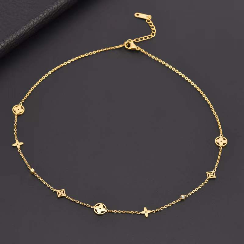 Minimalist Titanium Steel Hollow Four-Leaf Clover Necklace for Women with Electroplated Finish and Wavy Chain