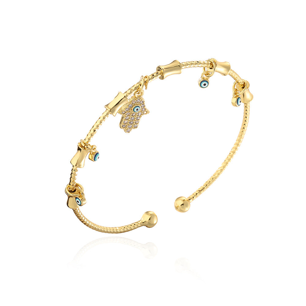 Bracciale Minimalista da Donna con Ciondolo a Mano Occhio di Allah Irregolare in Rame Placcato Oro 18K e Intarsio di Zirconi
