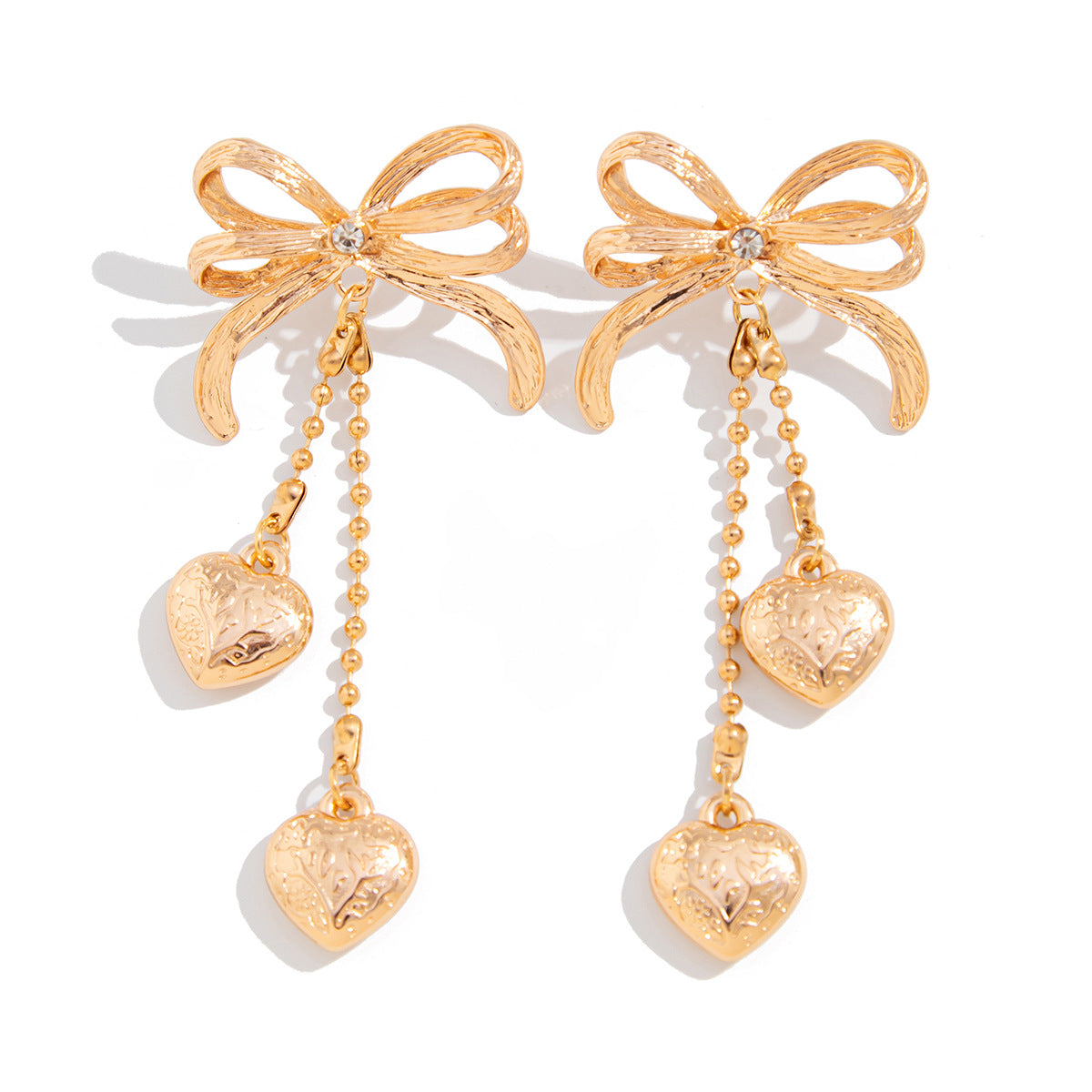 Pendientes largos minimalistas con borlas en forma de corazón y detalle de lazo en aleación chapada para mujer