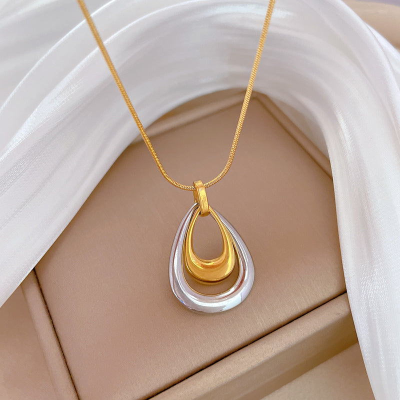 Collana con ciondolo geometrico a goccia minimalista in acciaio al titanio, catena a doppio strato, design floreale botanico, gioielli unisex alla moda per pendolari