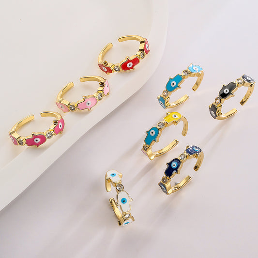 Anello da donna in rame con placca in oro 18K, finitura smaltata e intarsio in zircone, design Mano di Fatima