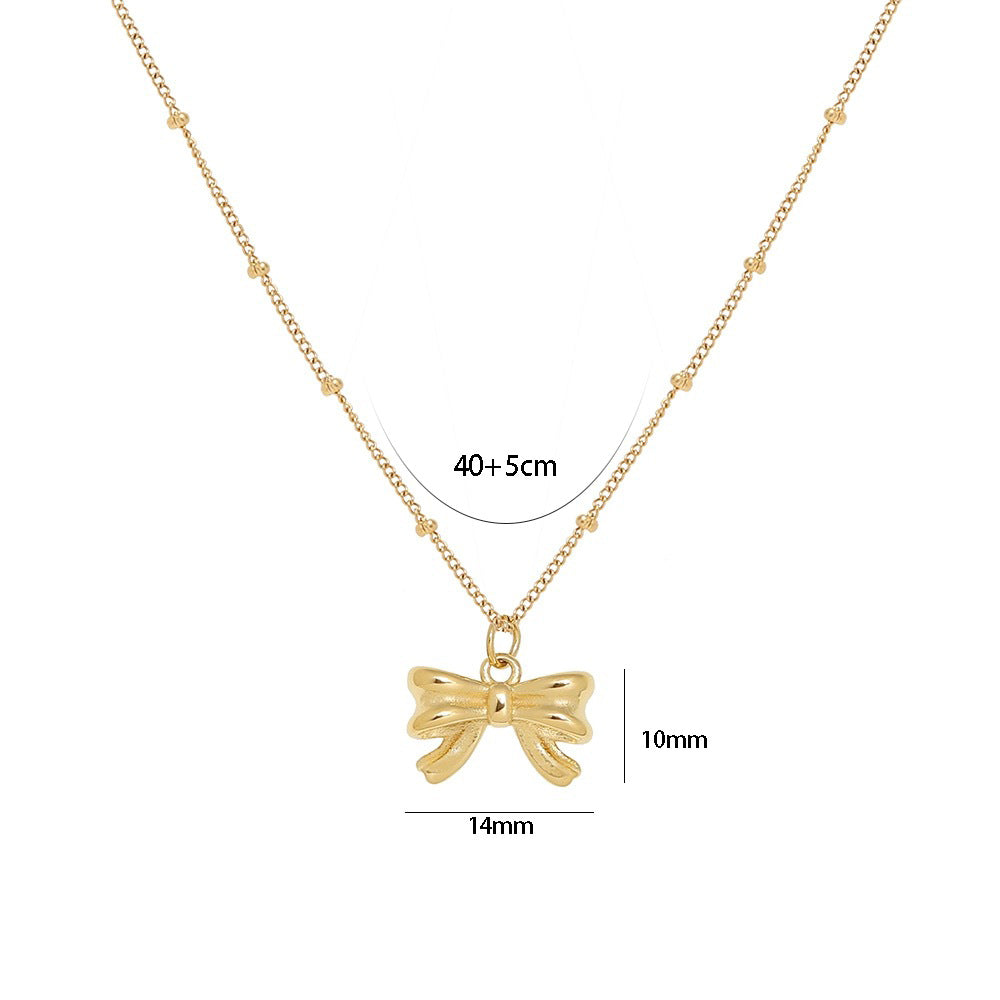 Elegante collar con colgante de lazo estilo francés para mujer en acero de titanio con chapado en oro de 18 quilates, delicada cadena de clavícula con una estética dulce y fresca