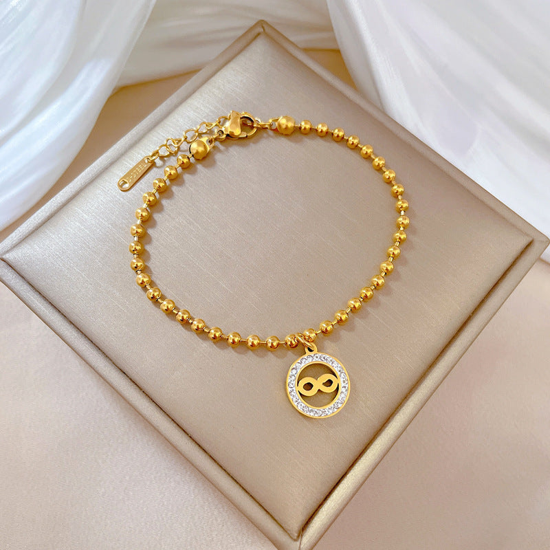 Bracciale da donna in stile vintage con cerchio di perline, realizzato in acciaio al titanio con placcatura in oro e texture ondulata