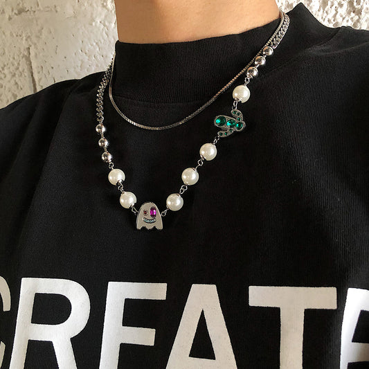 Edgy Ghost Face Pendant Necklace with Rhinestone Inlay and Pearl Accents on Alloy Cross Chain for Unisex