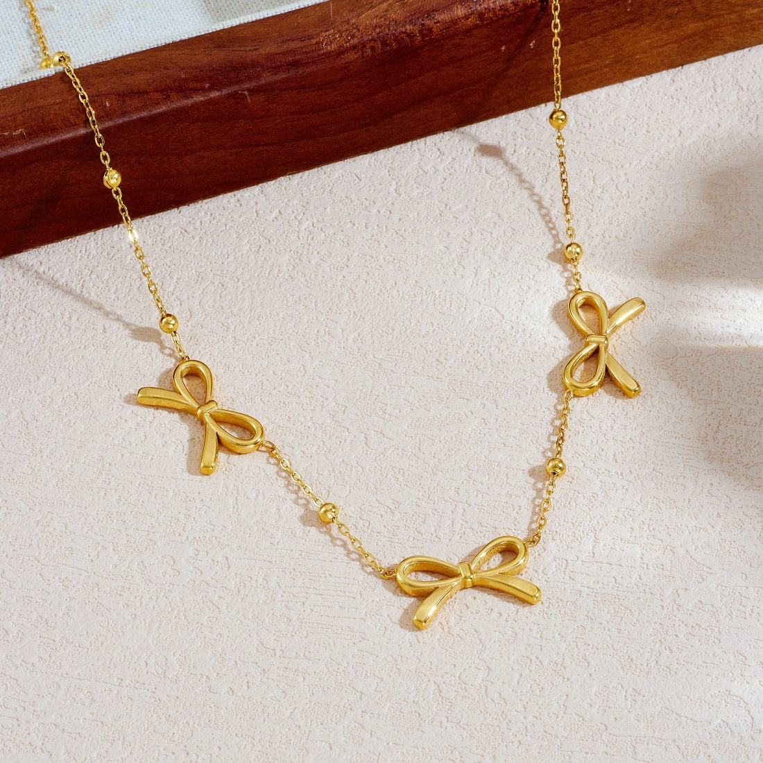 Gold Plated Hollow Bow Knot Stainless Steel Ball Chain Necklace for Women