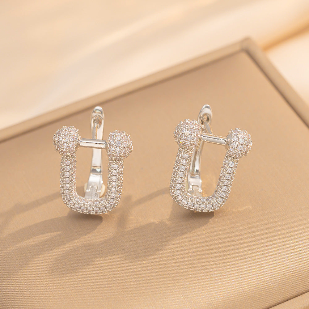 Orecchini a perno Saturno minimalisti color oro in ottone con zirconi per donna