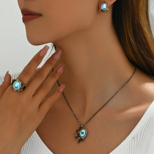 Set di collana, anello e orecchini da donna in rame con intarsio di pietra di luna e stile geometrico, con elementi di design ovali, ottagonali, quadrati smussati e lineari
