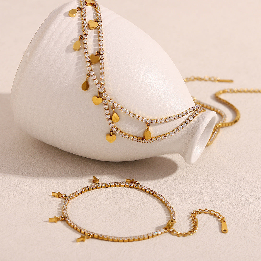 Set collana e bracciale pendente a croce a goccia minimalista in acciaio inossidabile con placcatura in oro 18 carati e accenti di zircone da donna