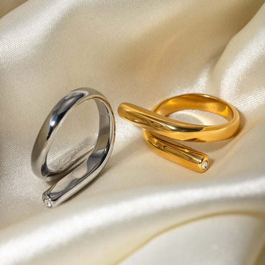 Minimalist Asymmetrical Interlocking Band Ring in Stainless Steel with 18K Gold Plating and Rhinestone Inlay