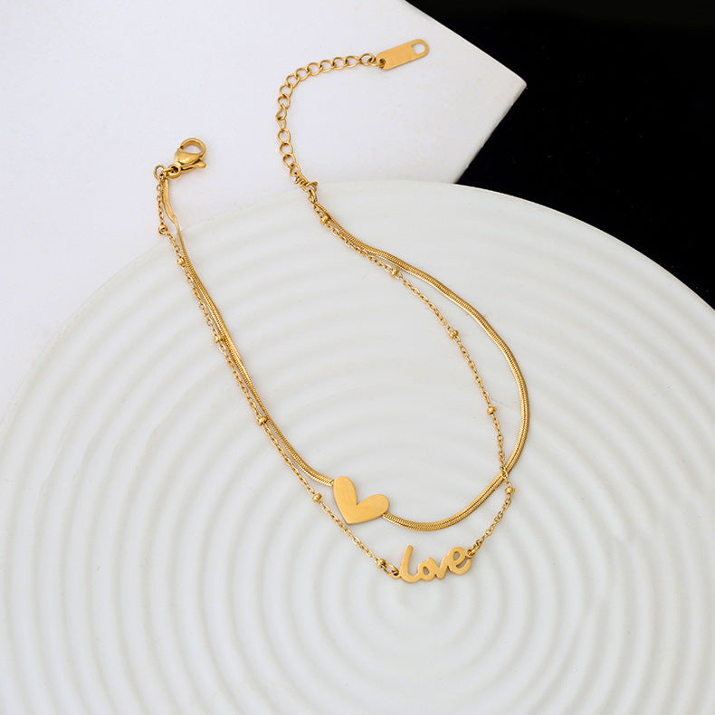Tobillera de Monedas Minimalista de Doble Capa para Mujer en Acero de Titanio con Chapado en Oro de 18K, Diseño en Forma de Corazón