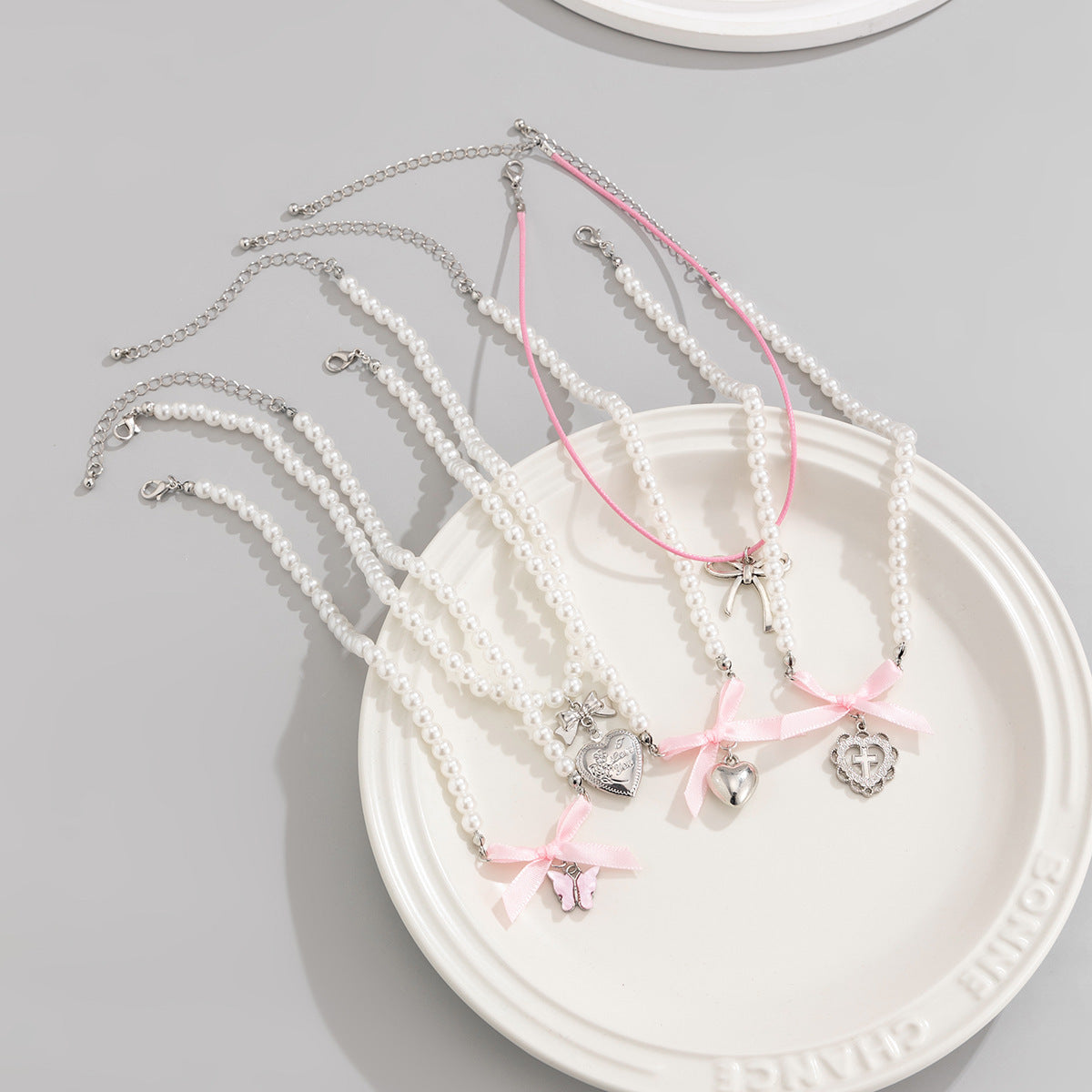 Sweet Minimalist Heart and Bow Knot Pendant Necklace for Women with Imitation Pearl Accents on Beaded Chain