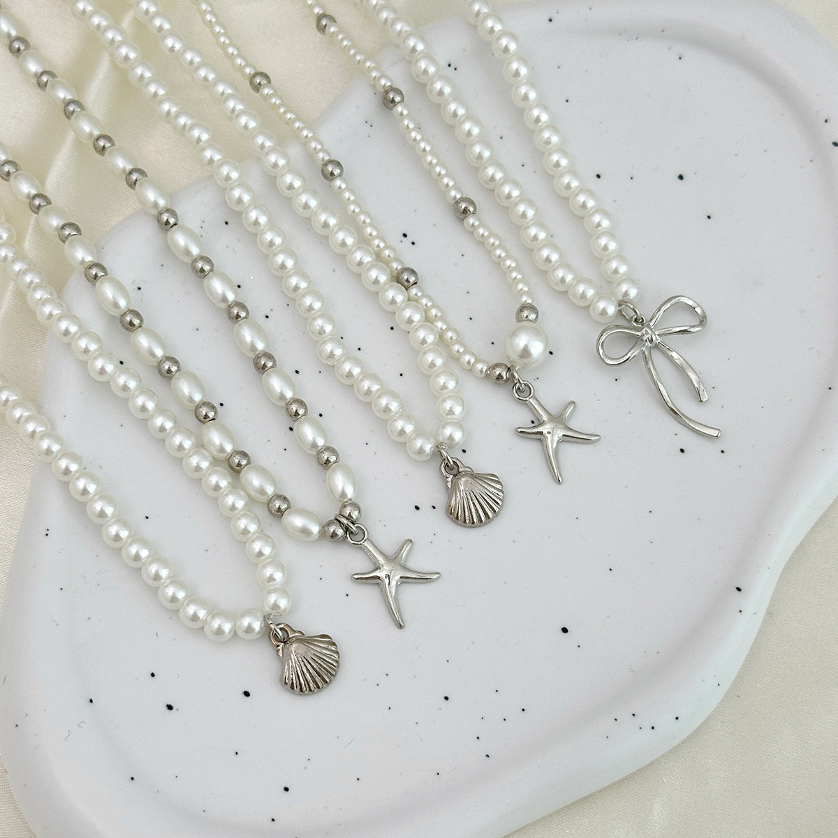 Minimalist Star and Bow Pendant Necklace for Women with Imitation Pearl Accents on Beaded Chain