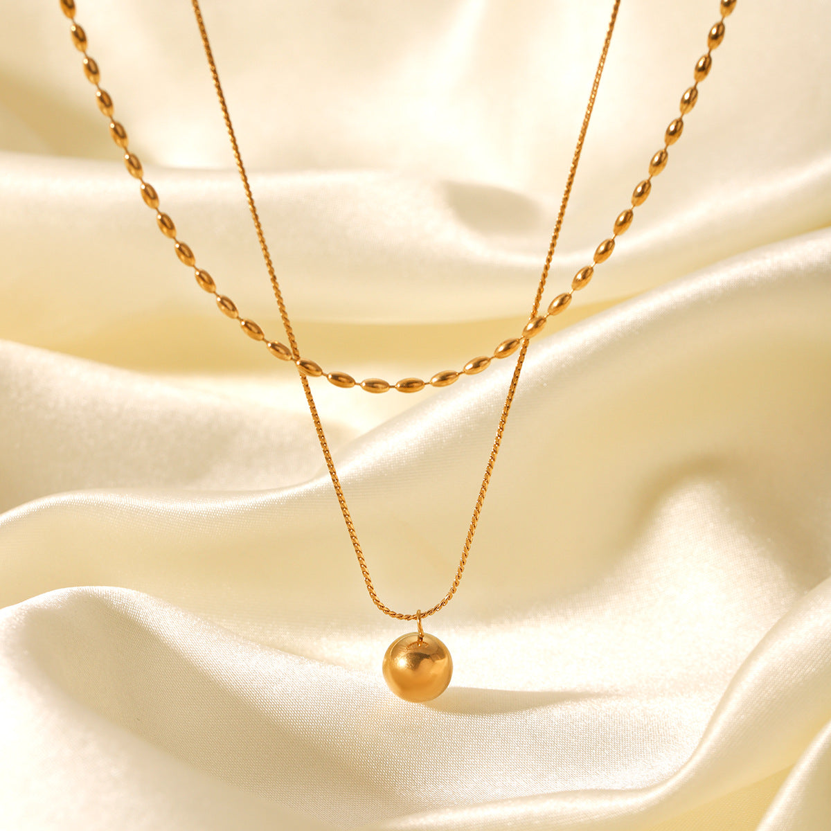 Minimalist Geometric Gold-Tone Stainless Steel Double-Layer Necklace with Small Spherical Pendant and Twisted Chain