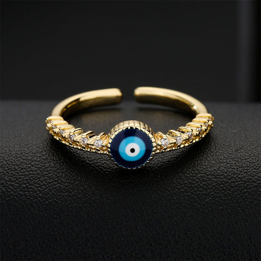 Anillo abierto geométrico de ojo turco en cobre con baño de oro de 18 quilates y micro circonitas pavé