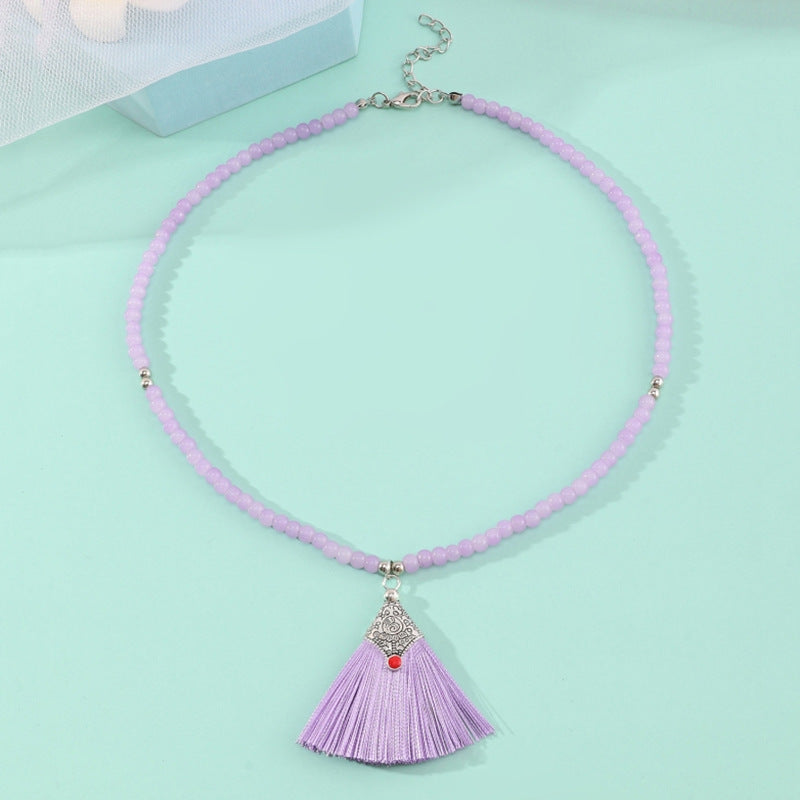 Collana pendente con nappe in stile bohémien per bambini, realizzata in perline di vetro con nappe abbinate su catena di perline rotonde