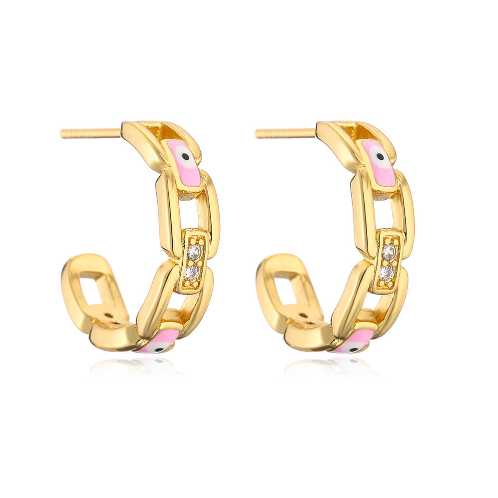 Orecchini geometrici in rame placcato oro con smalto a forma di occhio per donna