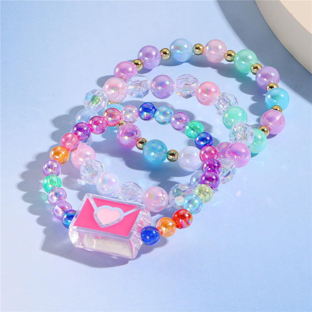 Juego de pulseras de resina con cuentas en forma de corazón estilo caricatura con dijes de cola de sirena y conchas marinas para niños