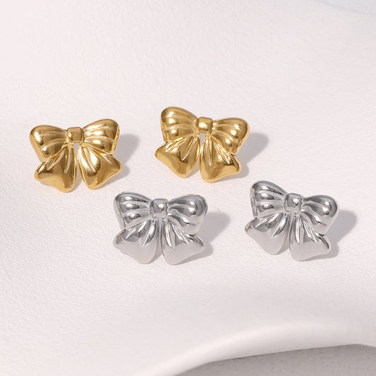 Orecchini a perno da donna in acciaio inossidabile placcati oro a forma di fiocco, stile minimalista